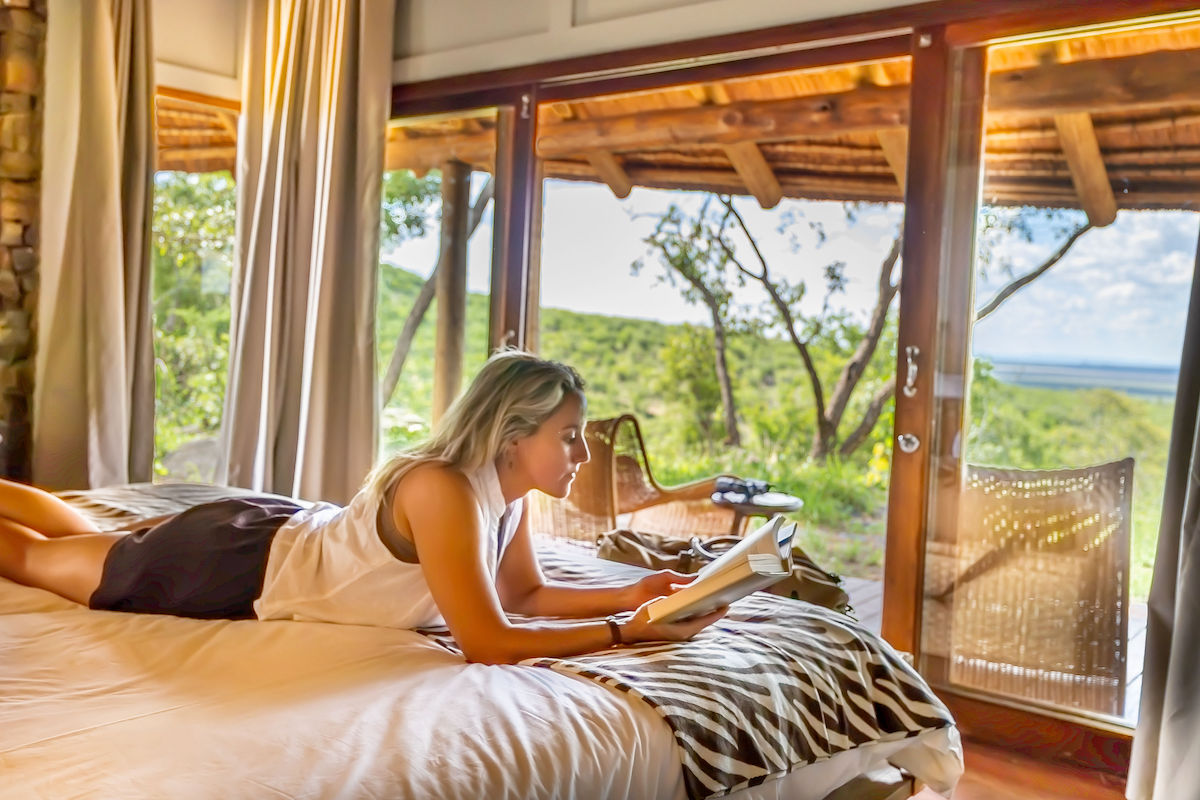 Safari lodge interior with bush view